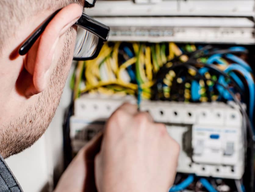 electrician working on electrical panel